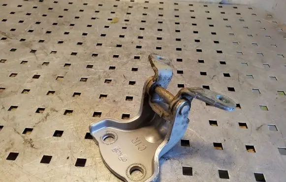 Rear door upper hinge