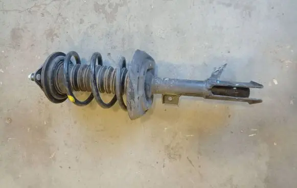 Toyota Sienna XL40 IV Front shock absorber with coil spring 4851008110 1A100914A