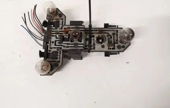 Tail light bulb cover holder