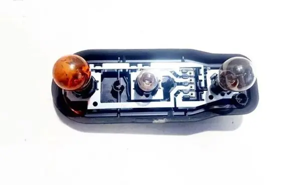 Tail light bulb cover holder