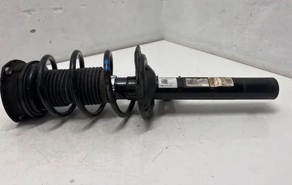 Volkswagen Golf Sportsvan Front shock absorber with coil spring 5Q0412014 50Q413023