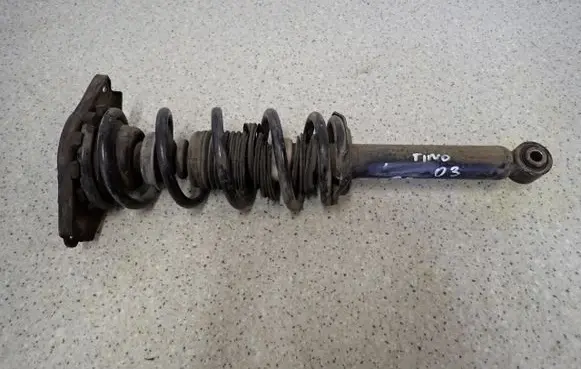 Nissan Almera Tino Front shock absorber with coil spring