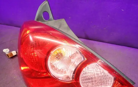 Nissan Versa Rear/tail lights 26555EM01A