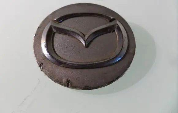 Mazda 323 Original wheel cap 2477 F2512