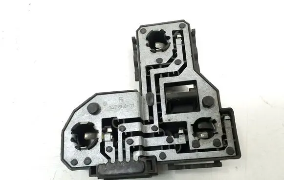 Tail light bulb cover holder