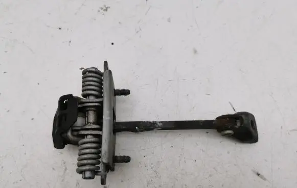 Front door check strap stopper