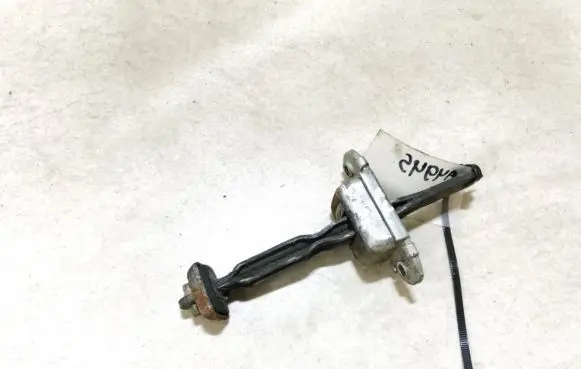 Front door check strap stopper