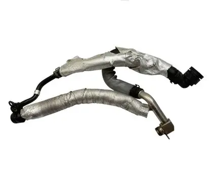 Volkswagen Golf VII Engine coolant pipe/hose 06K121065R
