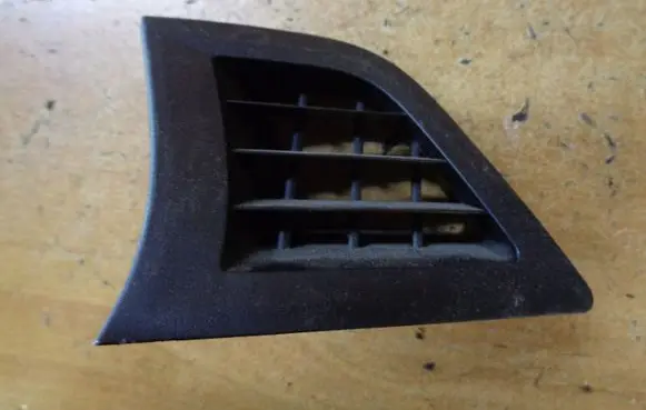 Subaru Legacy Dash center air vent grill 66115AJ010