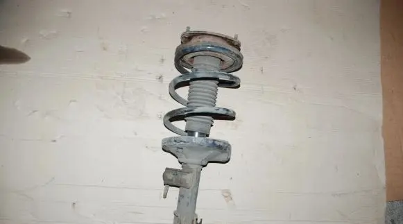 Suzuki Liana Front shock absorber with coil spring