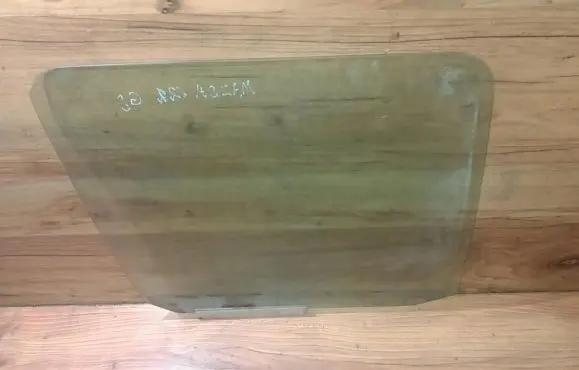 Mazda 121 Rear door window glass