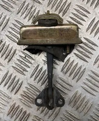 Front door check strap stopper