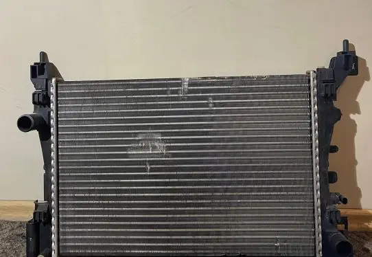 Opel Corsa D Coolant radiator 1300339 13399870