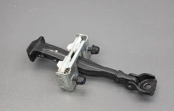 Front door check strap stopper