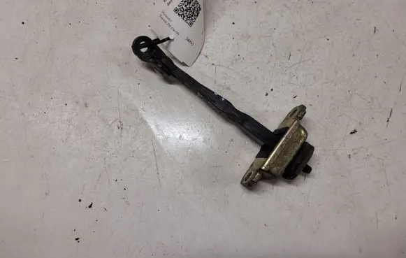 Front door check strap stopper