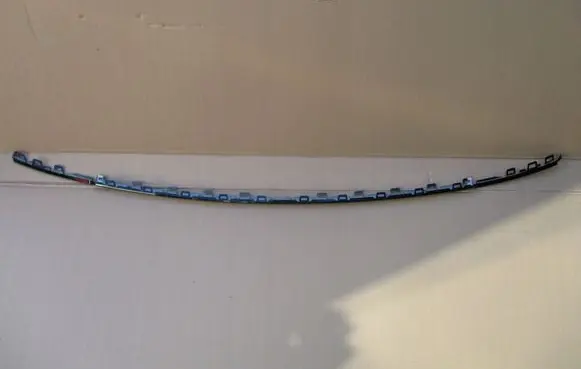 Rear bumper trim bar molding