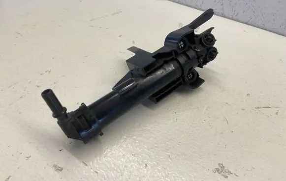 Headlight washer spray nozzle
