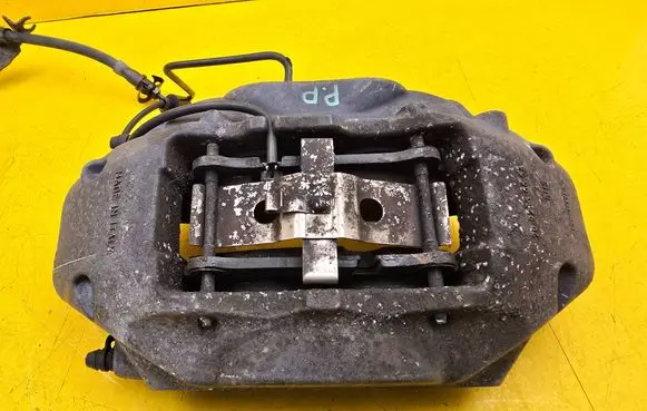 Volkswagen Touareg II Front brake caliper 7P6615106AE