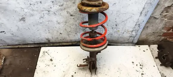 Mitsubishi Lancer X Front shock absorber with coil spring 