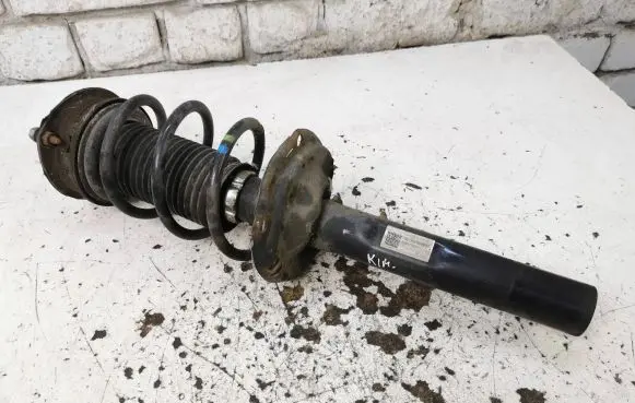 Volkswagen Golf VII Front shock absorber with coil spring 5Q0413023FJ