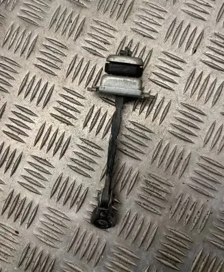 Front door check strap stopper