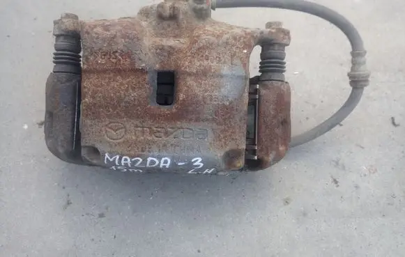 Mazda 3 II Front brake caliper