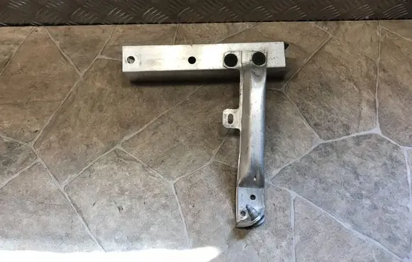 Radiator support slam panel bracket