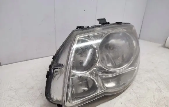 Chrysler Grand Voyager IV Headlight/headlamp 04857831AC