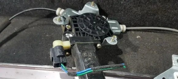 Front door window regulator motor