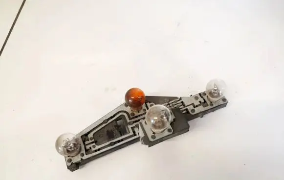 Tail light bulb cover holder
