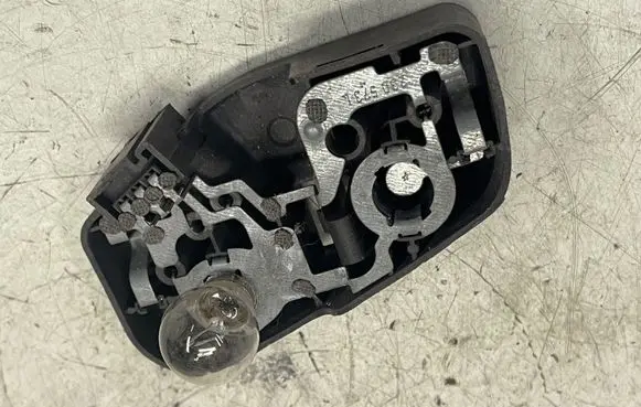 BMW 3 E46 Tail light bulb cover holder 230569L