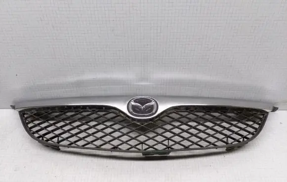 Mazda 626 Front bumper upper radiator grill MZ0706101