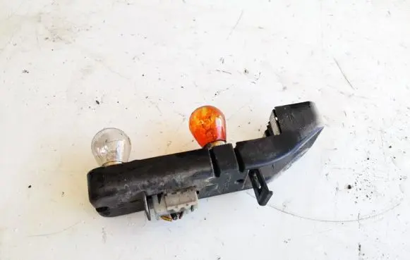 Tail light bulb cover holder