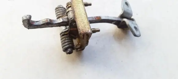 Front door check strap stopper