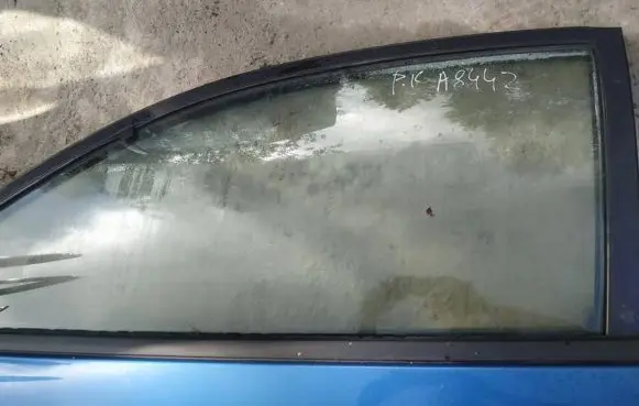 Mazda 323 Front door window glass four-door