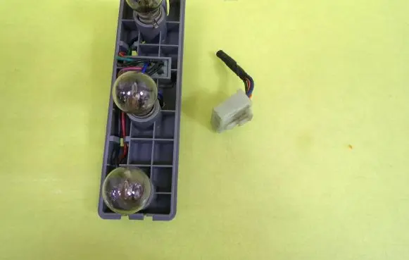 KIA Sportage Tail light bulb cover holder