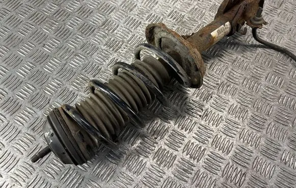 Opel Corsa D Front shock absorber with coil spring 13214357 GP27384