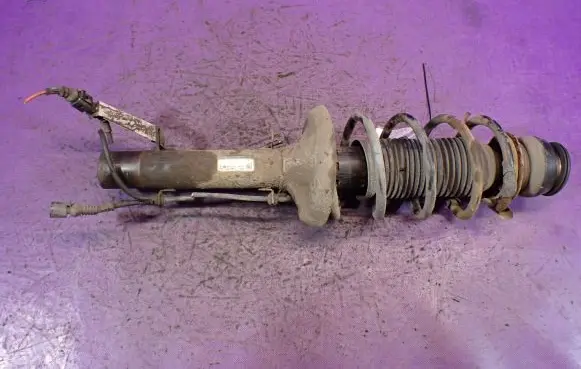 Volkswagen Golf IV Front shock absorber with coil spring 1J0413031S