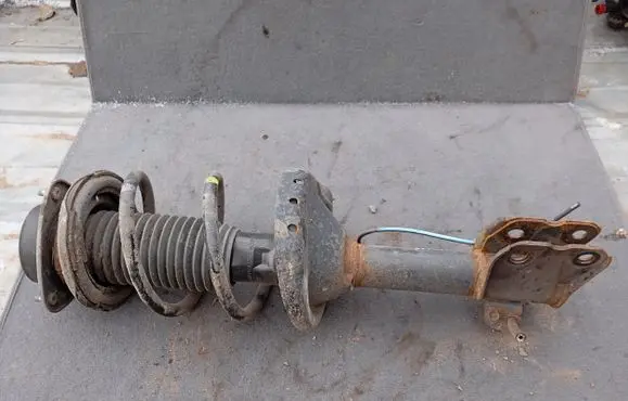 Subaru Outback Front shock absorber with coil spring