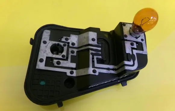 Tail light bulb cover holder