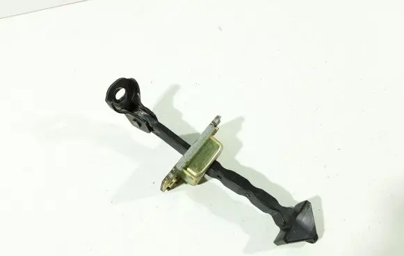 Front door check strap stopper