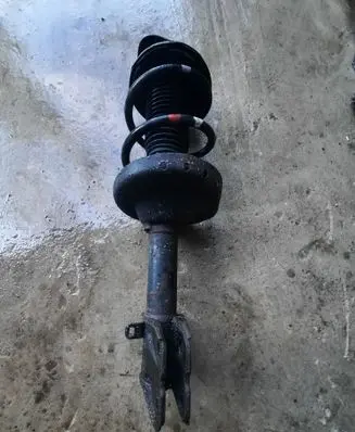 Subaru Legacy Front shock absorber with coil spring