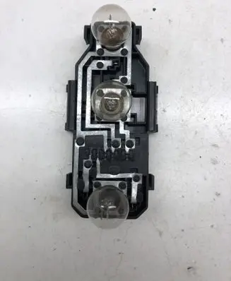 Tail light bulb cover holder