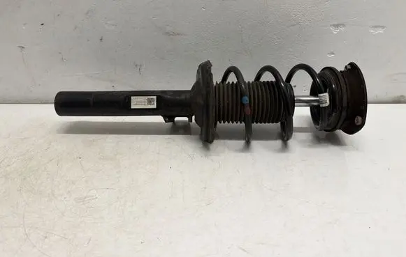 Volkswagen Golf VII Front shock absorber with coil spring 5Q0413023FH