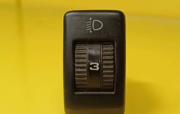 Headlight level height control switch