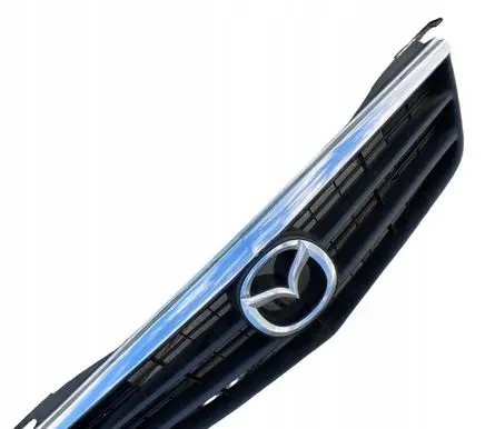 Mazda 626 Front bumper upper radiator grill GG2M50712