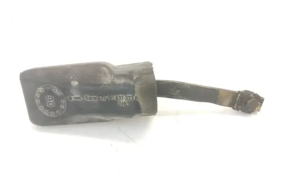 Front door check strap stopper