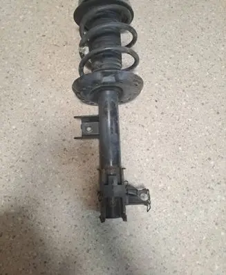 Front shock absorber with coil spring