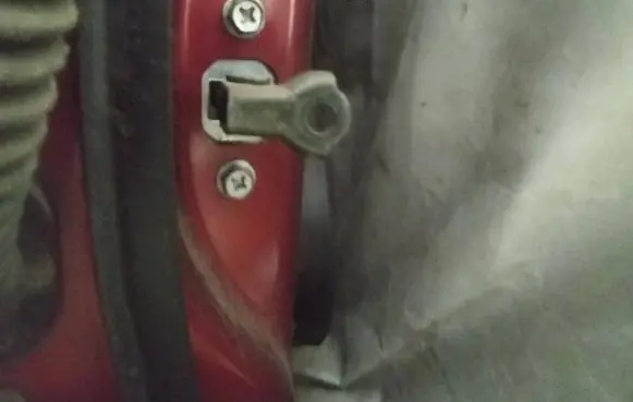 Front door check strap stopper