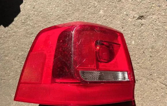 Tail light bulb cover holder